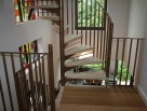 Scandinavian Spiral Stairs with Wooden Treads, Plain and Simple Steel Riser Bars, Metal Baluster and Metal Handrails