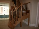 Combination wooden staircase with metal balusters