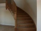 Helical staircase with wooden balusters