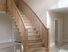 Helical staircase with wooden balusters