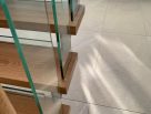 Steel staircase with timber treads and glass balustrades